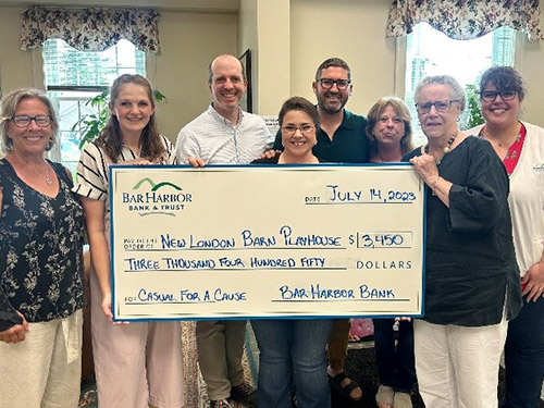 BHBT employees present a donation to New London Barn Playhouse