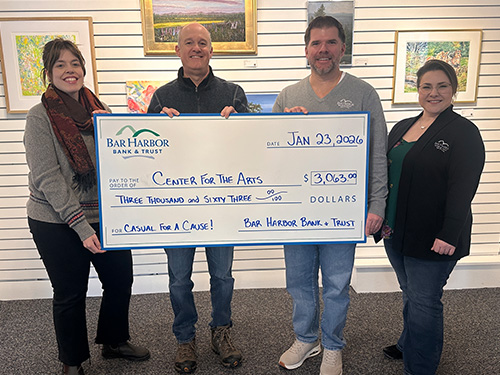BHBT employees present a donation to Center for the Arts