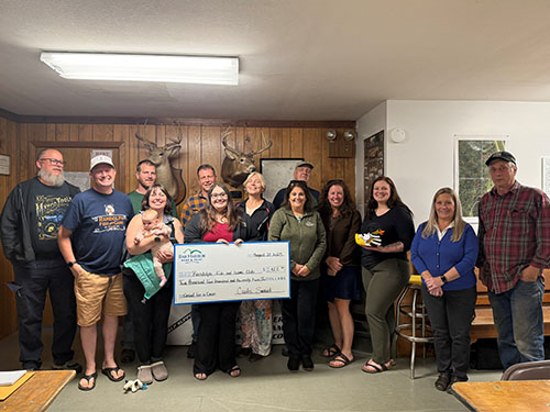 BHBT employees present a donation to Randolph Fish & Game Club