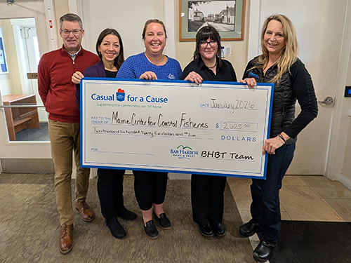 BHBT employees present a donation to Maine Center for Coastal Fisheries
